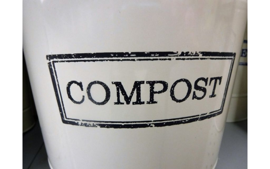 Compost bin sitting on counter indoors