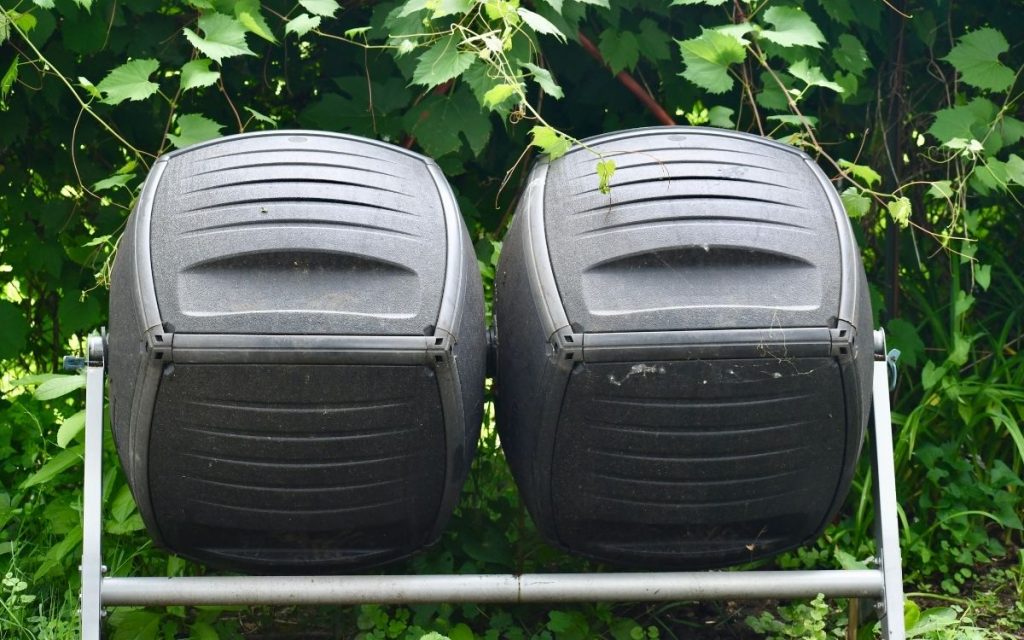 Tumbler composter sits outside