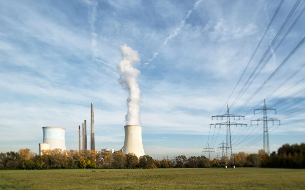 coal power plant letting out billows of smoke