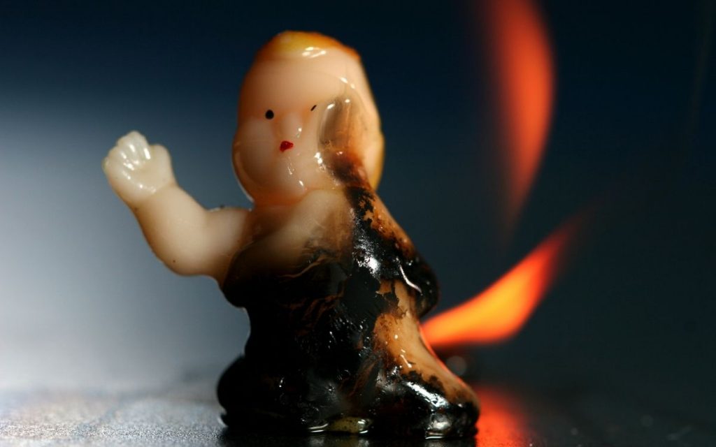 plastic figurine burning