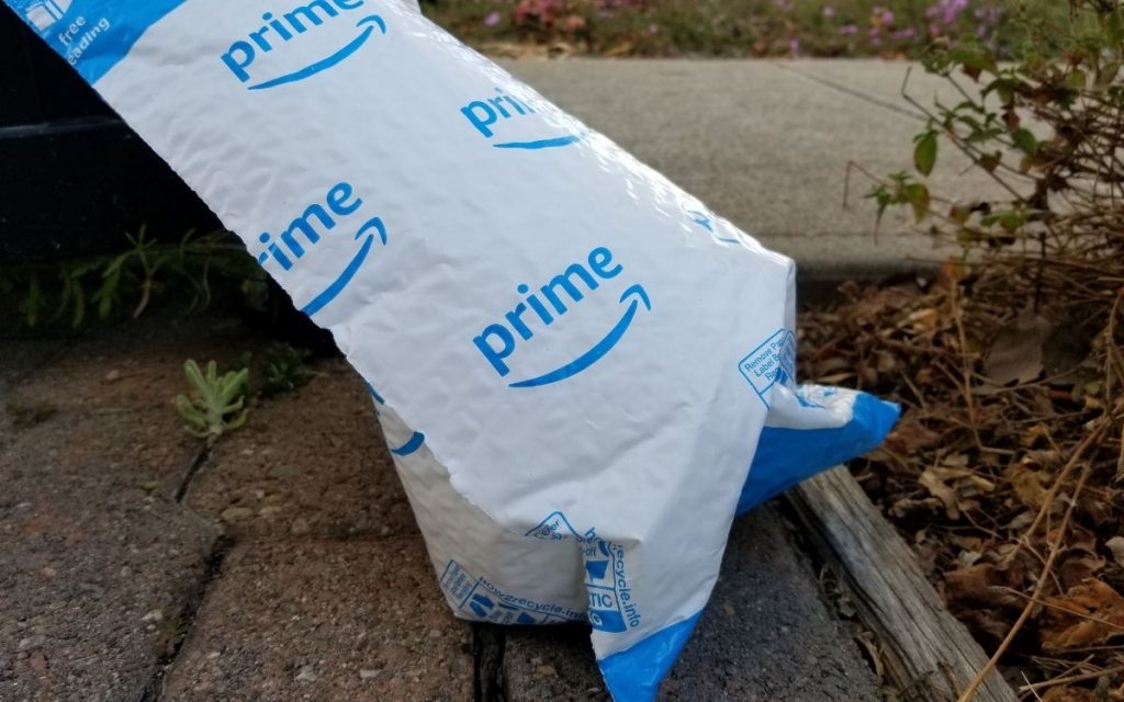 amazon mailer sits outside as litter