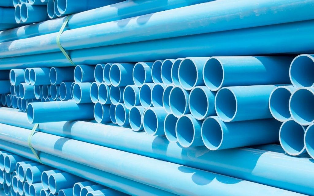 pvc pipes sit stacked up in bundles