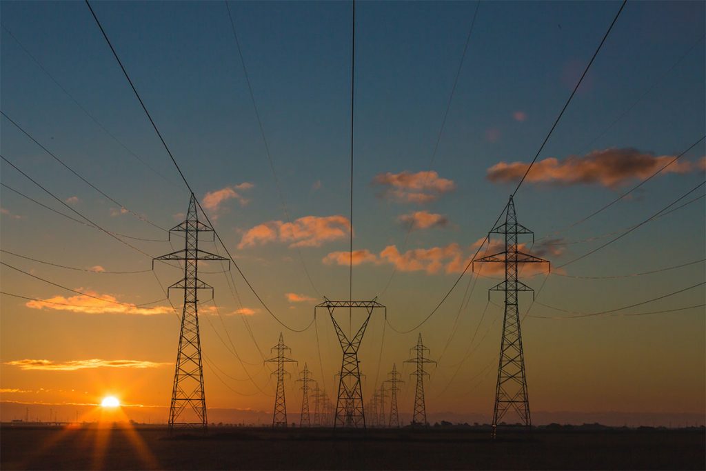 power towers lines sunrise