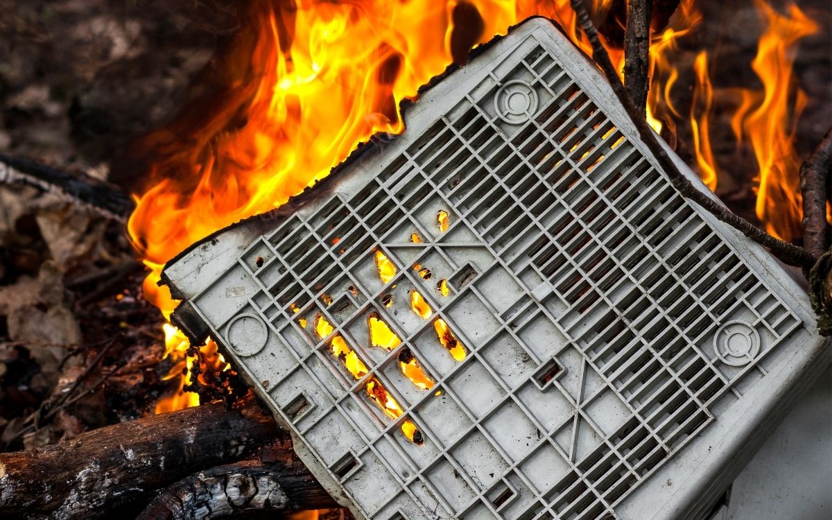 computer monitor sits aflame in a fire