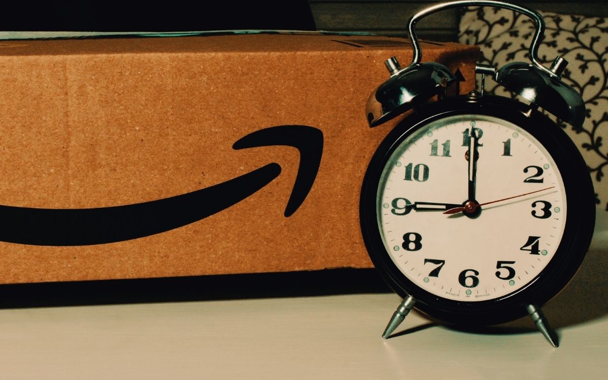 amazon box sits next to a clock